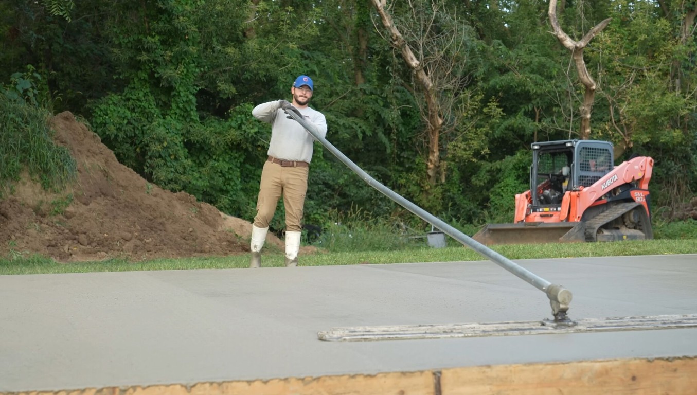 Professional concrete contractor finishing a slab in Atascocita, TX